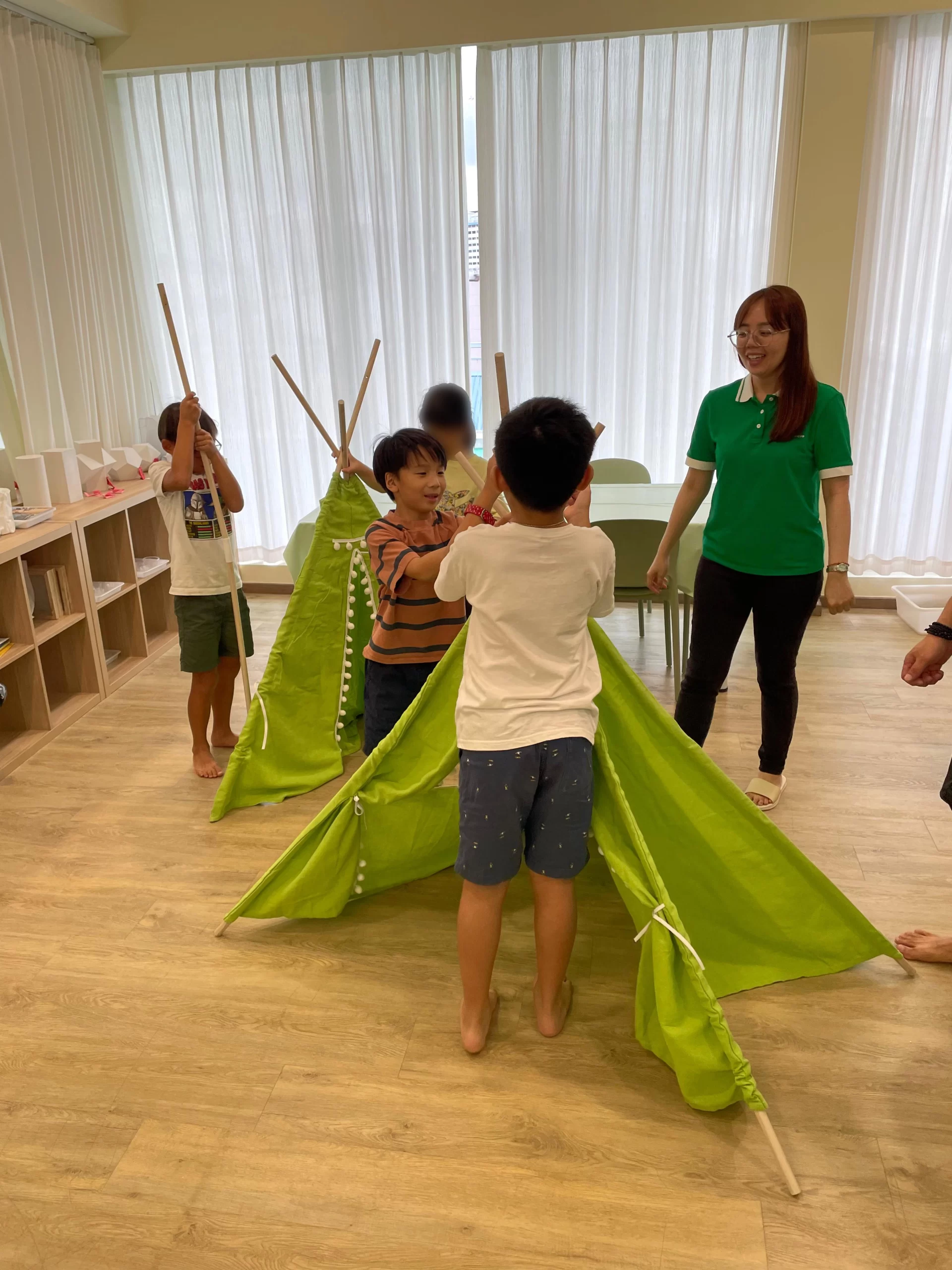 A child engaged in an activity at Sapling Grove